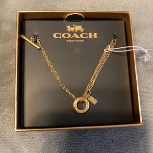 Gold Coach bracelet